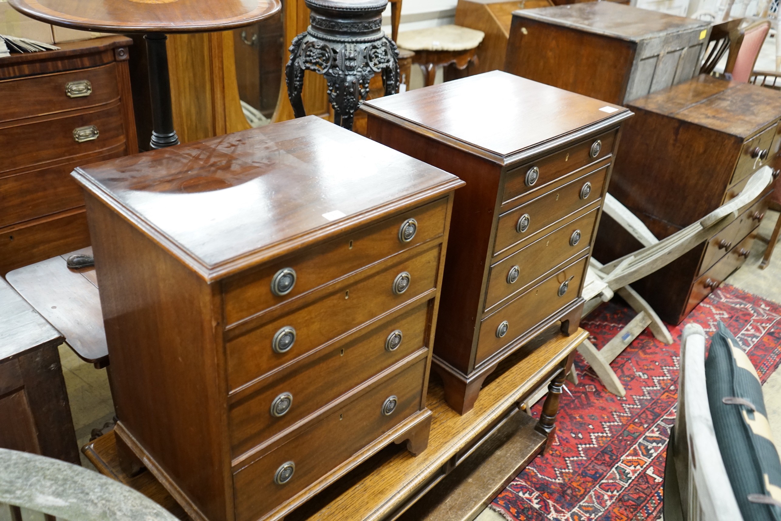 A pair of reproduction George III style mahogany bedside chests, width 56cm, depth 43cm, height 70cm